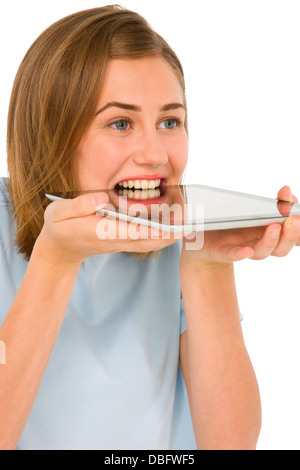 teenage girl with tablet in mouth Stock Photo