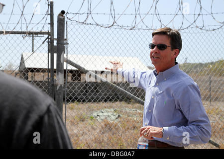 Former Guantanamo Bay prison commander, Ret. Col. Terry Carrico, tours what now remains of Camp X-Ray, July 26, 2013, at U.S. Naval Station Guantanamo Bay, Cuba. Carrico was the first commander of Camp X-Ray when it was established in 2002 as a temporary Stock Photo