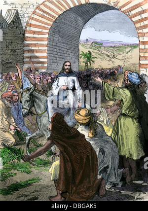 People strewing palm fronds in the path as Jesus enters Jerusalem on a donkey. Hand-colored woodcut Stock Photo