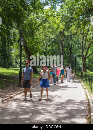 People walking in Central Park, New York City, Manhattan, and enjoying a hot summer day Stock Photo