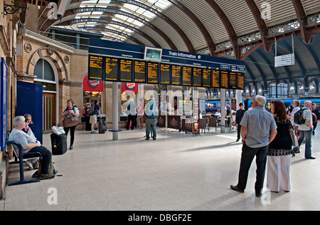 Passengers wait in front of the destination displays at York Railway Station on the East Coast Mainline in England, UK Stock Photo