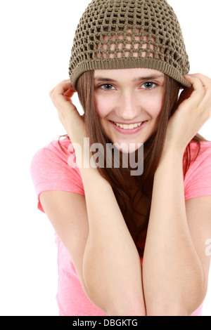 Pre-teen girl in casual clothes do stretching exercises seated on bed ...