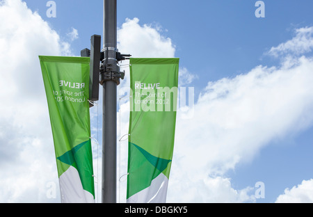 Relive London 2012, Banners in foreground against sky background, London, Olympic Stadium Anniversary games. Stock Photo