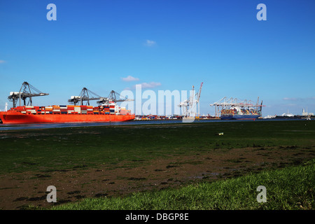 Container shipping dock with 2 cargo ships Stock Photo