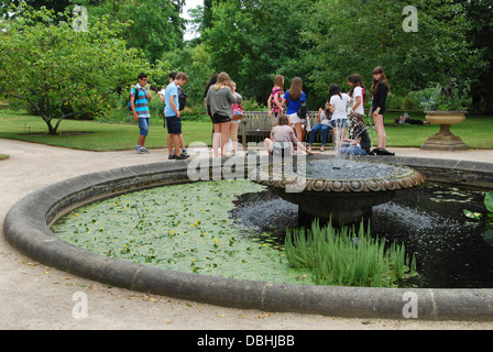school class in The University of Oxford Botanic Garden close to Magdalen College Oxford UK Stock Photo