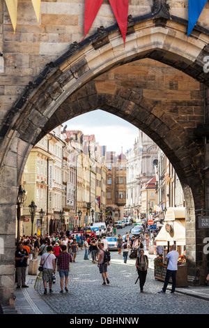 View towards Mala Strana (Lesser Quarter) through the archway on Charles Bridge in Prague. Stock Photo