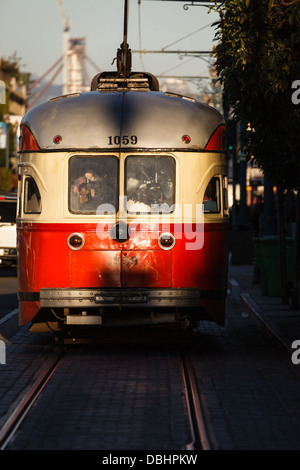 Trolley car gleams in sunlight in San Francisco street Stock Photo