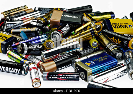 Old used alkaline batteries on white background Stock Photo