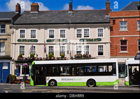 Black Swan Hotel,  1737, Market Place, Devizes,  Wiltshire, England, with a bus in front Stock Photo