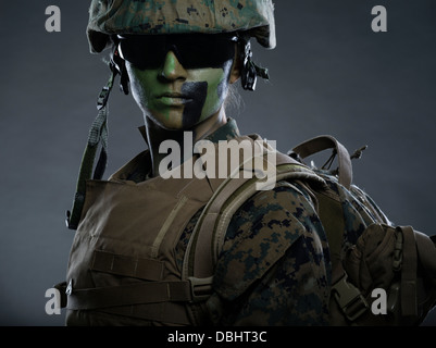 Portrait of Female United States Marine Corps Soldier in utility uniform  MARPAT pixelated camouflage with camo face paint Stock Photo - Alamy