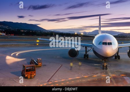 A budget airline prepares it's aircraft for take off from Malaga airport in southern Spain. Stock Photo