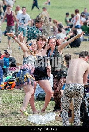 Glastonbury Festival 2013 UK - Three girls have their photograph taken near the stone circle. Stock Photo