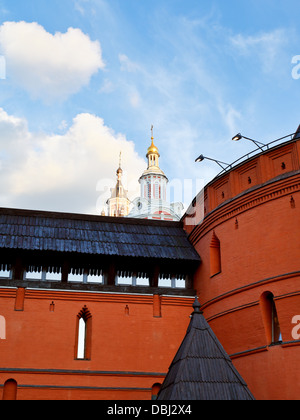 towers of Zaikonospassky monastery over old Kitay-gorod wall in Moscow Stock Photo