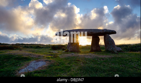 A star burst of sun gleaming through Lanyon Quoit an ancient neolithic Dolmen in Cornwall Stock Photo