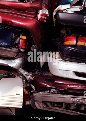 Piled up crushed cars on a scrap yard Stock Photo