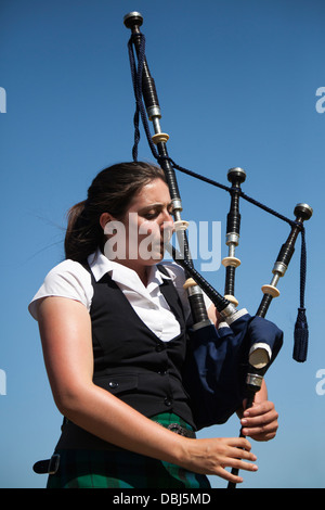 Scottish female piper at the annual Tomintoul Highland games and gathering held on the 3rd Saturday in July, at the showground. Stock Photo