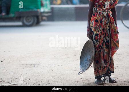 Rural Bangladeshi women perform manual labor carrying dirt for three dollars $3 a day on a road project in Chittagong Bangladesh Stock Photo