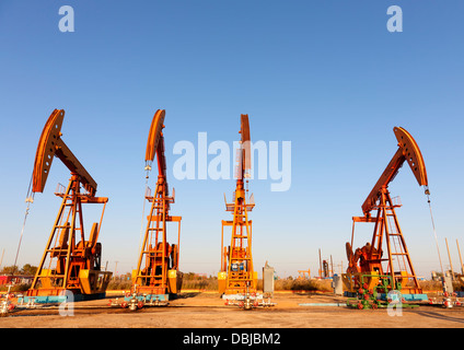 Huge steel oil pump jacks. (HDR) Stock Photo