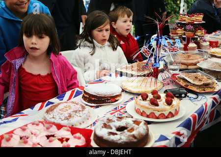 Children Looking At Cakes During Cake Competition At Street Party During Queen's Diamond Jubilee Surrey England Stock Photo