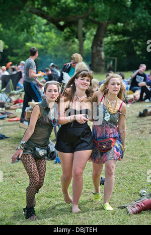 Glastonbury Festival 2013 UK Three girls support each other near the stone circle Stock Photo
