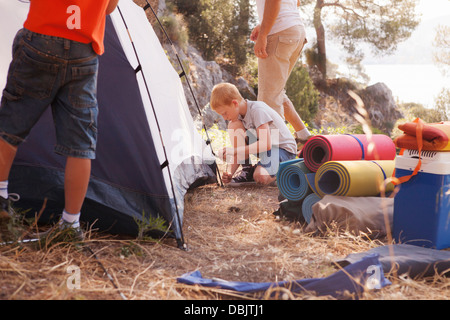 Croatia, Dalmatia, Family holidays on camping site, pitching the tent Stock Photo