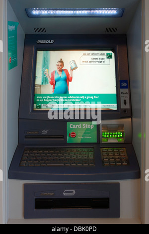 Dutch message on screen of indoor ATM cash dispenser at cashpoint of the BNP Paribas Fortis bank, Belgium Stock Photo