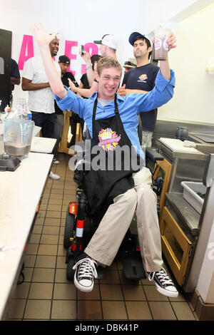 Zach Anner creates his Handi-Cappuccino shake at Millions Of Milkshakes in West Hollywood. Ingredients include vanilla ice cream, coffee powder, crushed oreo cookies, caramel, chocolate cyrup, whipped cream and a cherry West Hollywood, California - 29.06. Stock Photo