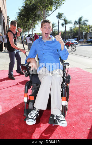 Zach Anner creates his Handi-Cappuccino shake at Millions Of Milkshakes in West Hollywood. Ingredients include vanilla ice cream, coffee powder, crushed oreo cookies, caramel, chocolate cyrup, whipped cream and a cherry West Hollywood, California - 29.06. Stock Photo