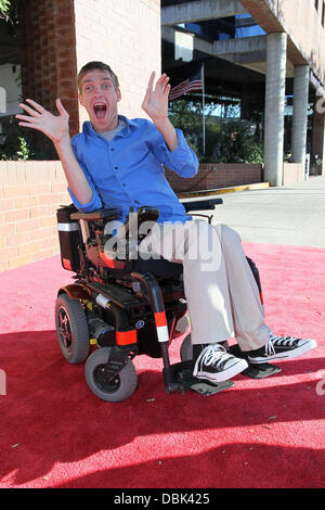 Zach Anner creates his Handi-Cappuccino shake at Millions Of Milkshakes in West Hollywood. Ingredients include vanilla ice cream, coffee powder, crushed oreo cookies, caramel, chocolate cyrup, whipped cream and a cherry West Hollywood, California - 29.06. Stock Photo