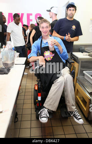 Zach Anner creates his Handi-Cappuccino shake at Millions Of Milkshakes in West Hollywood. Ingredients include vanilla ice cream, coffee powder, crushed oreo cookies, caramel, chocolate cyrup, whipped cream and a cherry West Hollywood, California - 29.06. Stock Photo