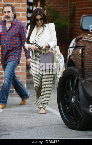 Kim Kardashian, wearing a white blazer and striped maxi dress, is seen leaving a beauty salon in West Hollywood West Hollywood, California - 29.06.11 Stock Photo