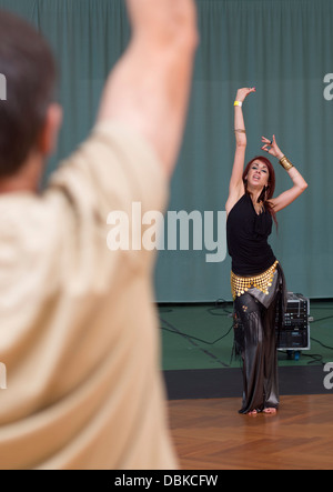 Woman in belly dancing class Stock Photo