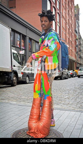 Portrait of Sidi known as Leghead, a New York artist, posing with one of his creations in the Soho section of downtown, NYC Stock Photo