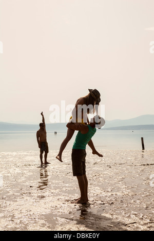 Croatia, Young couple on beach fooling about Stock Photo