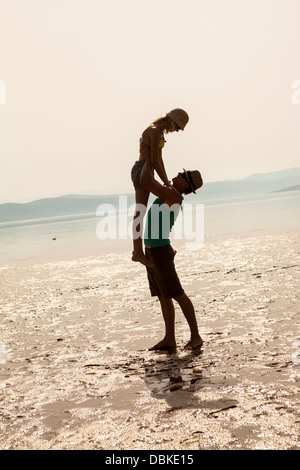 Croatia, Young couple on beach fooling about Stock Photo
