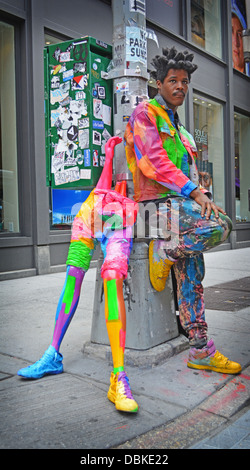Portrait of Sidi known as Leghead, a New York artist, posing with one of his creations in the Soho section of downtown, NYC Stock Photo