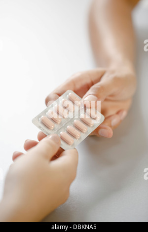 Handing Over Tablets Stock Photo