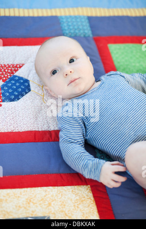 Baby boy lying on back, Munich, Bavaria, Germany Stock Photo