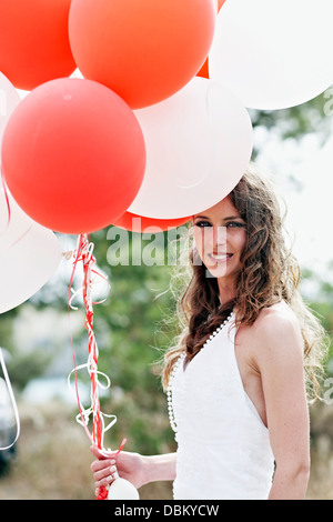 Bride Holding Bunch Of Balloons, Croatia, Europe Stock Photo