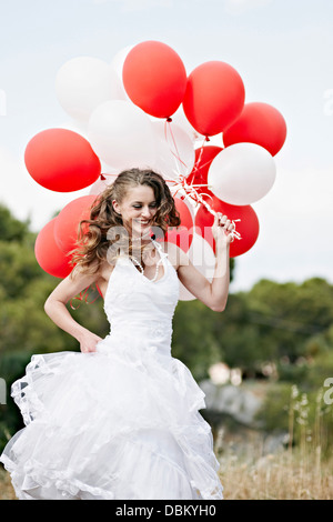 Bride Holding Bunch Of Balloons, Croatia, Europe Stock Photo