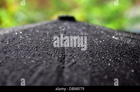 Water Droplets on Umbrella top view from Kerala Monsoon Rain season Stock Photo