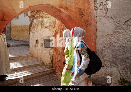 Women walking by the streets of Moulay Idriss. Morocco Stock Photo