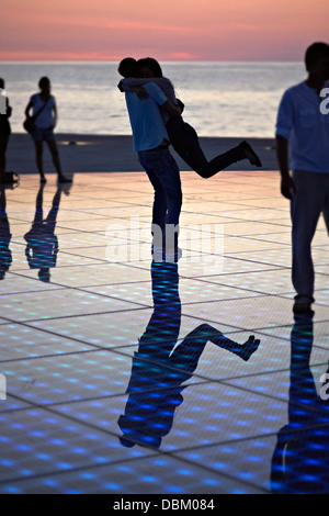 Croatia, Dalmatia, Solar panels as a dance floor, sunset in background Stock Photo