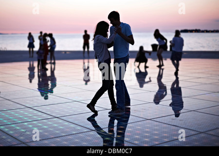 Croatia, Dalmatia, Solar panels as a dance floor, sunset in background Stock Photo