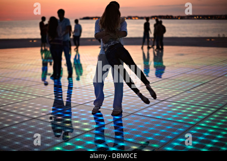 Croatia, Dalmatia, Solar panels as a dance floor, sunset in background Stock Photo