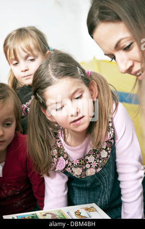 Teacher And Children In Nursery School, Kottgeisering, Bavaria, Germany, Europe Stock Photo