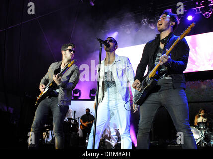 Raleigh, North Carolina, USA. 31st July, 2013. Singers NICK JONAS, KEVIN JONAS and JOE JONAS of the pop group The Jonas Brothers performing at the Red Hat Amphitheatre. Credit:  Tina Fultz/ZUMAPRESS.com/Alamy Live News Stock Photo