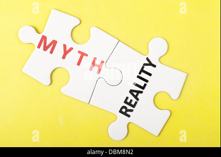 Myth and reality words on two pieces of puzzle Stock Photo