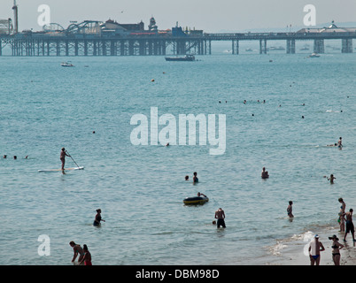 People enjoying the sea and beach in Brighton on a hot summer's day Stock Photo