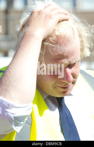 Elephant and Castle, London UK. 1st August 2013. London Mayor Boris Johnson struggles to cope with the heat on the hottest day of the year during visit a regeneration project site at Elephant & Castle in south east London Credit:  amer ghazzal/Alamy Live News Stock Photo